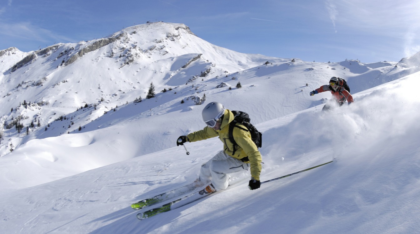 Skier enjoying some fresh tracks in powder.